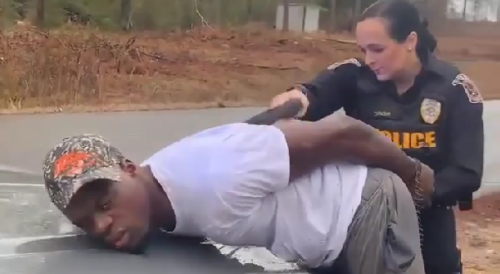 Female Cop Laughing While Tasing Handcuffed Black Man