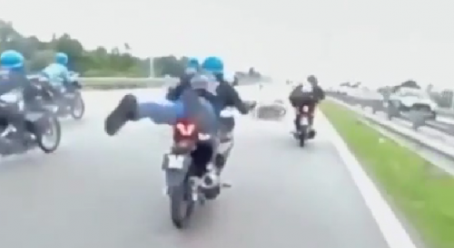Motorcyclists Crash Performing "Superman" Stunt on Malaysian Freeway