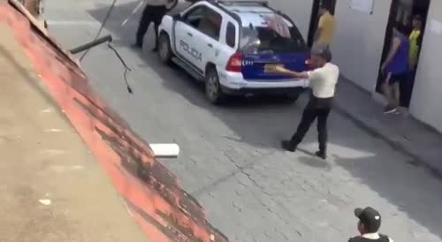 Guy in a Riot Suit Attacks Police with Katana