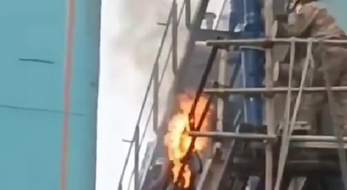 Beijing Worker Catches Fire