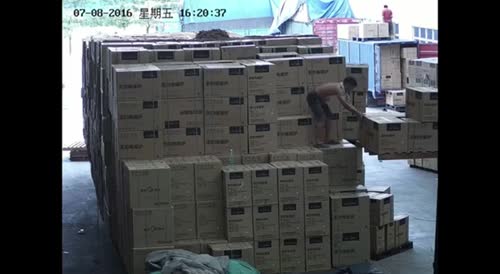 Worker fell on his back while trying to Stack boxes