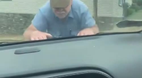 MAGA dumbfuck jumps on the hood of a car
