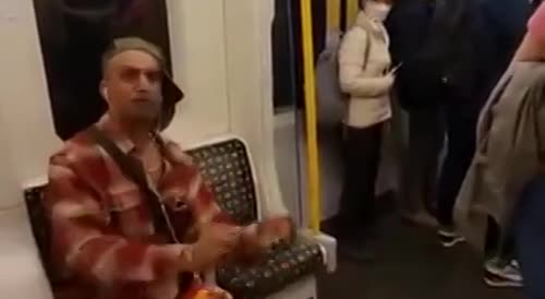 Dude Tweaking Out on Subway in the UK