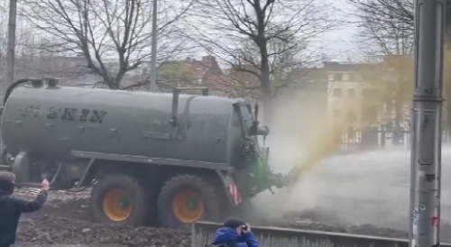 Protesting farmers spray manure at police during demonstration in Brussels