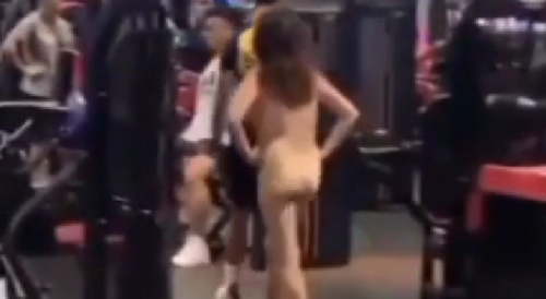 Asian woman gets naked in gym