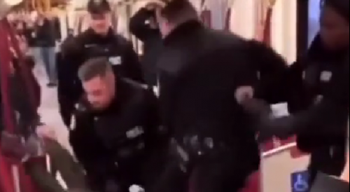 Cop Delivering Some Heaad Kicks on a Suspect