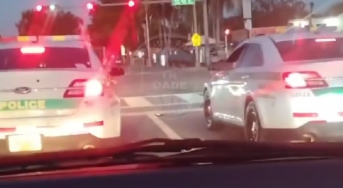Florida cops appear to race cruisers down street