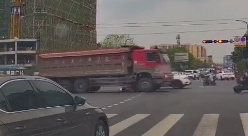 Woman on bike gets well smeared by classic red truck