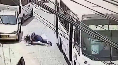 Woman Falls Out Of Moving Bus