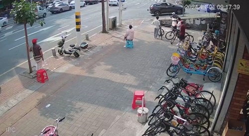 Chinese Biker Stopped By Car
