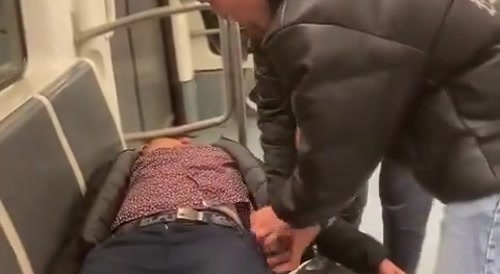 Sleeping Man Gets Phone Stolen On The Subway Train In Barcelona
