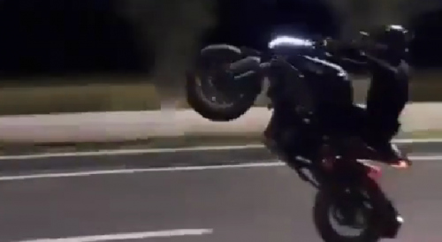 Motorcycle driver scrapes his ass on road