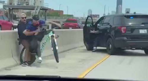 Cop tackles a man off stolen bike on a Chicago expressway