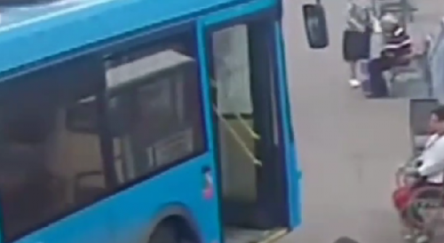 Bus Mounts Pavement, Crushes Woman