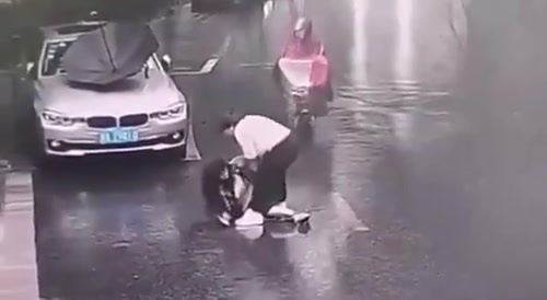 Woman With An Umbrella  Ran Over In China