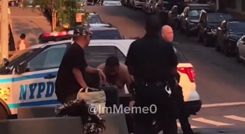 Lawless NYC: A half-naked man stands on top of a vehicle while two NYPD female officers sit inside