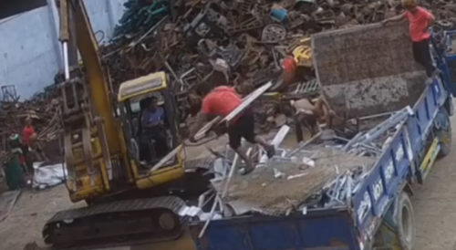 Scrap Yard Worker Nearly Kills Himself By An Accident