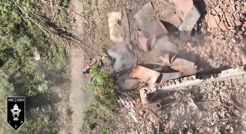 Two soldiers standing still to avoid drone detection and getting hit anyway