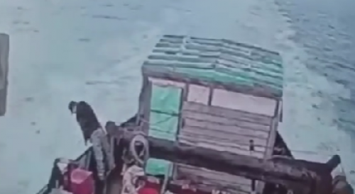 Pissing man falls overboard of a moving ship