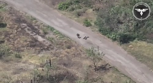 Soldier jumps off motorbike as an FPV drone approaches, only to be hit moments later