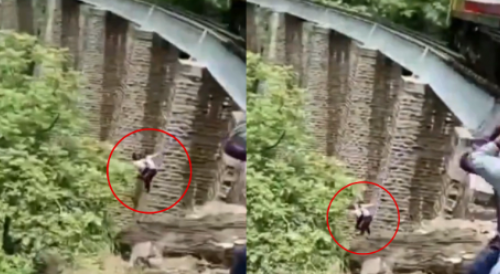 Couple Jumps From 90-Feet Rail Bridge During Photo Shoot