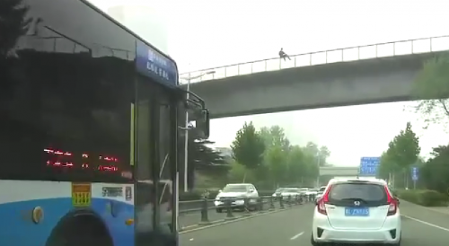 Mna Leaps From  An Overpass In China