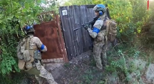 Ukrianians Clean up streets and buildings in Severny on the outskirts of Toretsk.