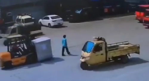 Woman walking on a busy road gets run over and killed by Forklift