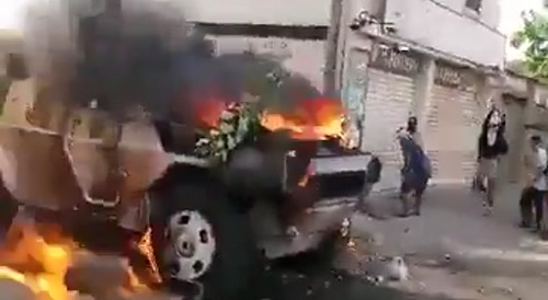 Rioters Set Police Car Ablaze In Caracas