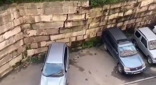 Driver saves his car moments before wall collapse