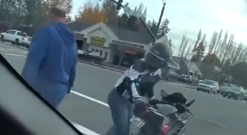 Blue hoodie guy elevates a road rage incident into a felony.