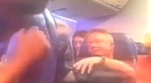 He tries black man on airplane, and gets scared when he realizes he is bigger