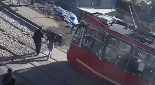 Careless Couple Knocked Out By Tram In Poland