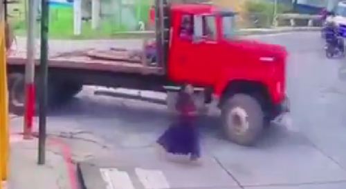 Careless Woman Ran Over Truck In Guatemala