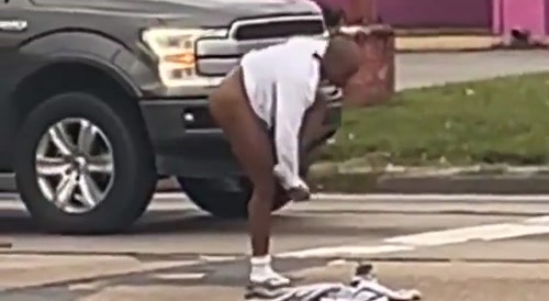 Crazy Bald Black Woman Naked in Traffic