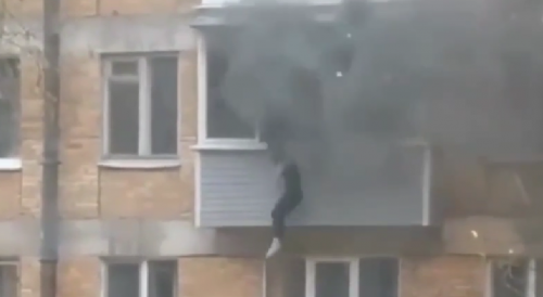 Woman Jumps Out Of The Burning Building