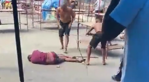 Thief Clubbed With Long Sticks By Vendors In Brazil