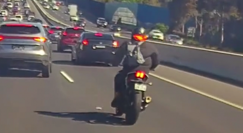 Aussie Biker Lands On Car Roof After High-Speed Collision