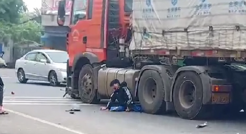 Moped Rider Survives Being Ran Over by Truck