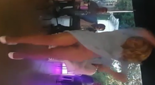 Woman dances without panties at party