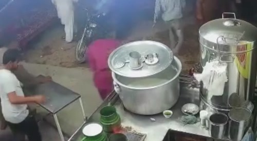 At the tea shop, the boy started fight with the shopkeeper because the cup of tea was late.