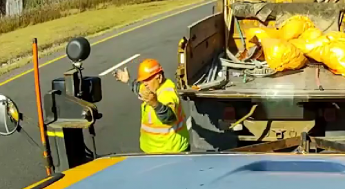 Road Worker Narrowly Dodges Truck On New York Highway