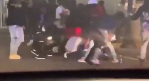 a group of young thugs making a pogrom to a guy