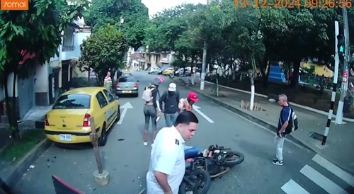 Motorcyclist ran a red light and collides with a bus at an intersection