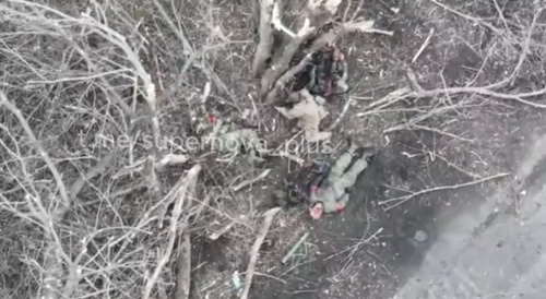 Ukrainian soldier helps the wounded and collects trophies.