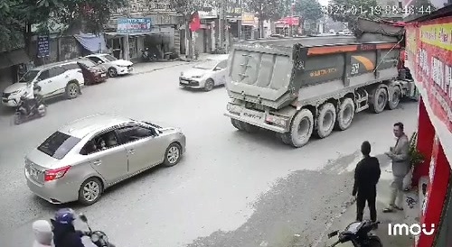 Vietnam: an old man on a bicycle is run over by a truck