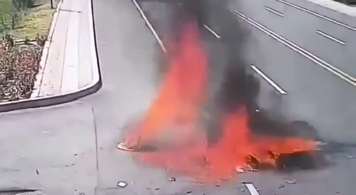 Motorcycle speeding on right lane set fire