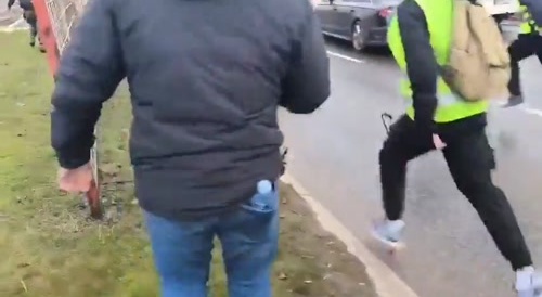 Idiot stands infront of car during protest