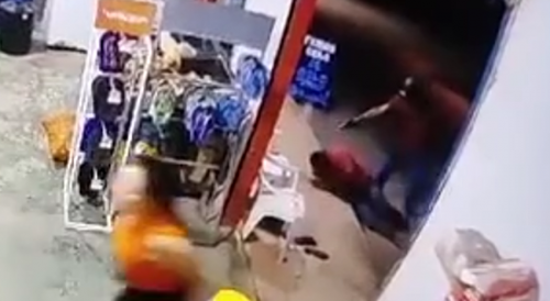 Dude Running Away from Hitman, falls, And is shot dead in front of commercial establishment