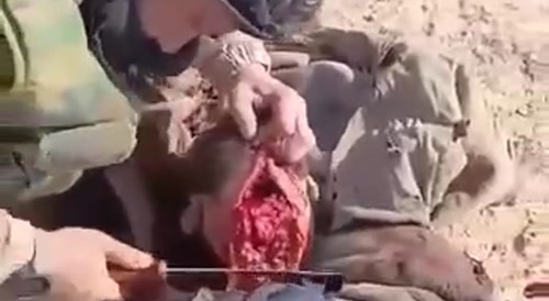 Iraqi tribesman chops an ISIS militant's head off